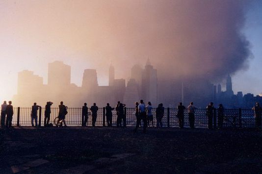 People looking at the smoking site from Brooklyn Heights